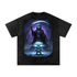 Kael the Ember Wraith Tee in Black — front view showing Kael character with blazing orange eyes and wide grin, fire demon shadow erupting behind on snow washed oversized tee